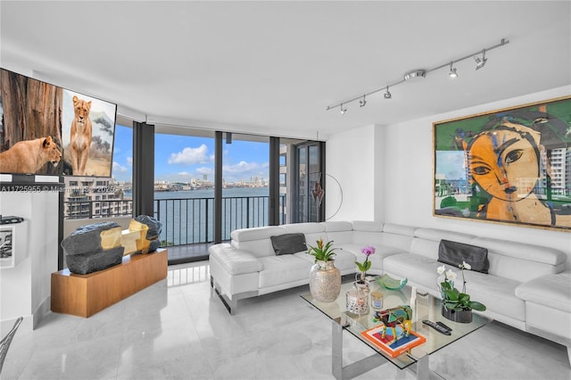 living room featuring floor to ceiling windows