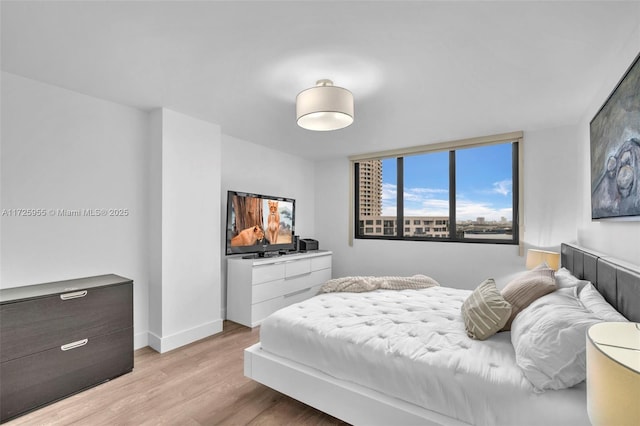 bedroom with light hardwood / wood-style flooring