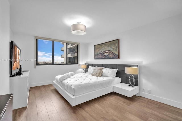 bedroom with wood-type flooring