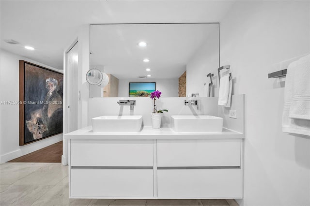 bathroom featuring tile patterned flooring and vanity