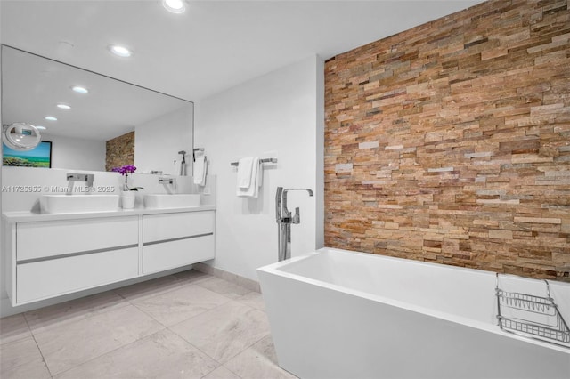 bathroom with vanity and a tub