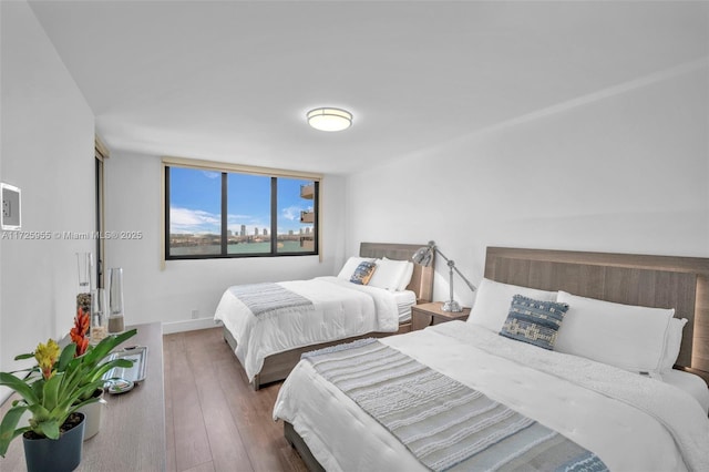 bedroom featuring dark wood-type flooring