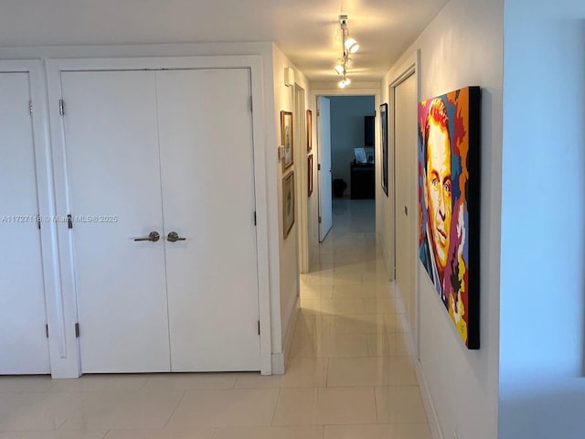 hallway featuring light tile patterned floors