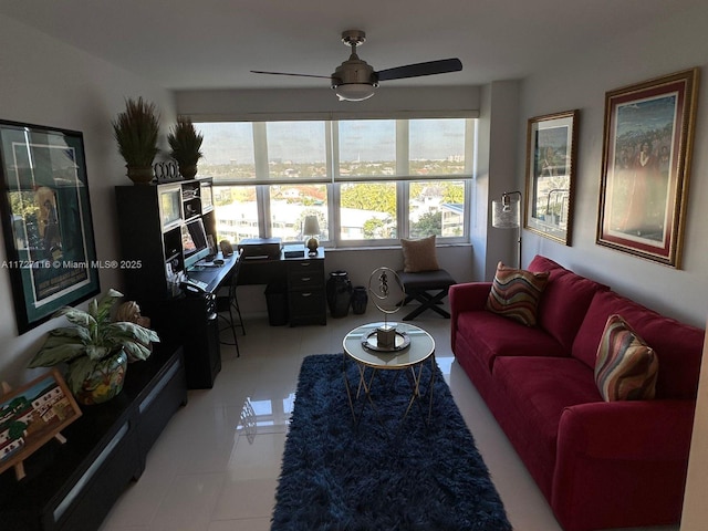 living room with ceiling fan and light tile patterned floors