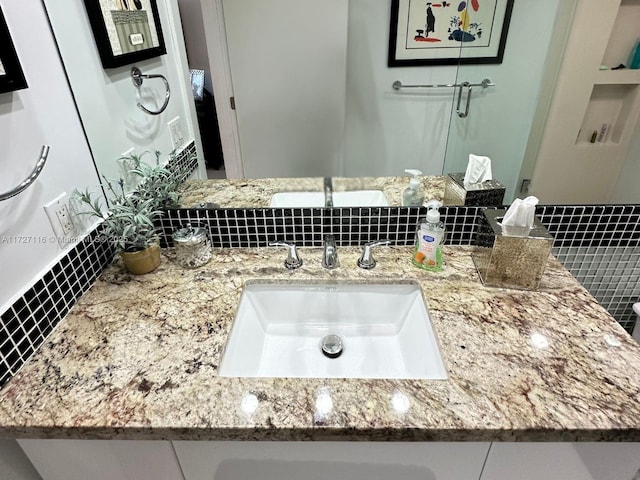 3300 NE 36th St Unit 605, Fort Lauderdale, FL 33308 - bathroom featuring vanity and backsplash