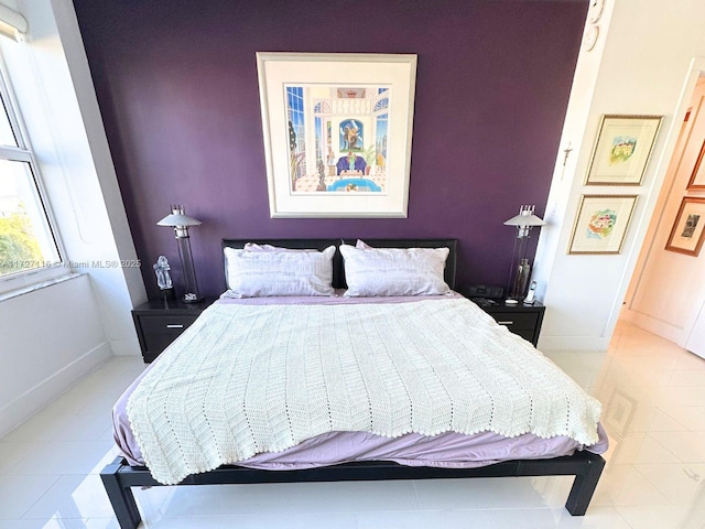 3300 NE 36th St Unit 605, Fort Lauderdale, FL 33308 - bedroom featuring light tile patterned floors and baseboards