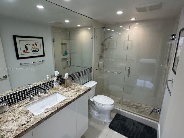 3300 NE 36th St Unit 605, Fort Lauderdale, FL 33308 - bathroom featuring toilet, vanity, a shower stall, tile patterned floors, and recessed lighting