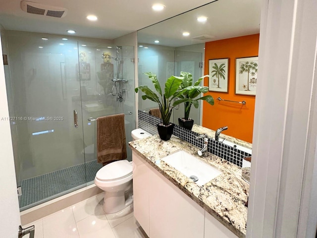 3300 NE 36th St Unit 605, Fort Lauderdale, FL 33308 - full bathroom featuring toilet, vanity, a stall shower, tile patterned floors, and recessed lighting
