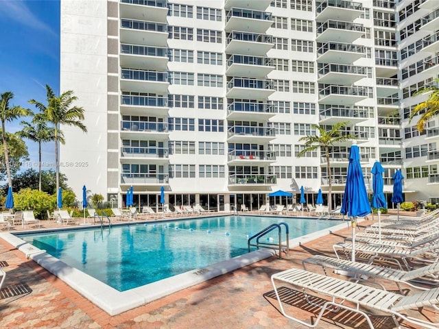 view of swimming pool featuring a patio area