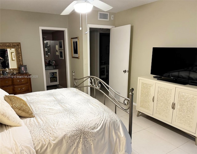 tiled bedroom with ceiling fan