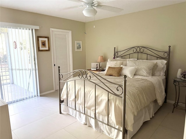 bedroom featuring ceiling fan, a closet, and light tile patterned floors