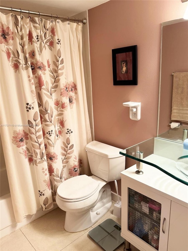 bathroom featuring tile patterned flooring, shower / bath combo with shower curtain, and toilet