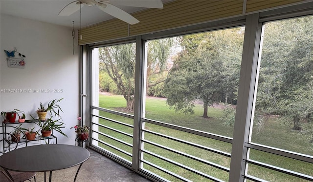 sunroom featuring ceiling fan