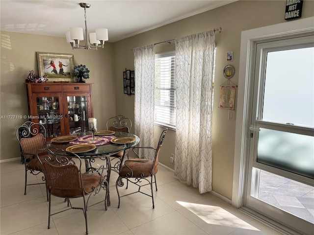 tiled dining space with a notable chandelier