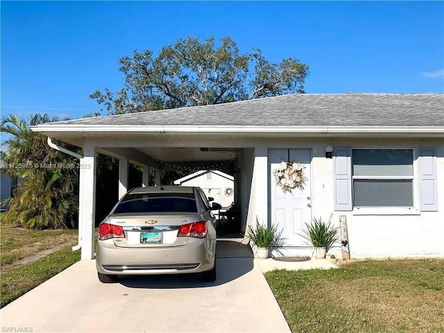 view of parking / parking lot featuring a carport and a yard