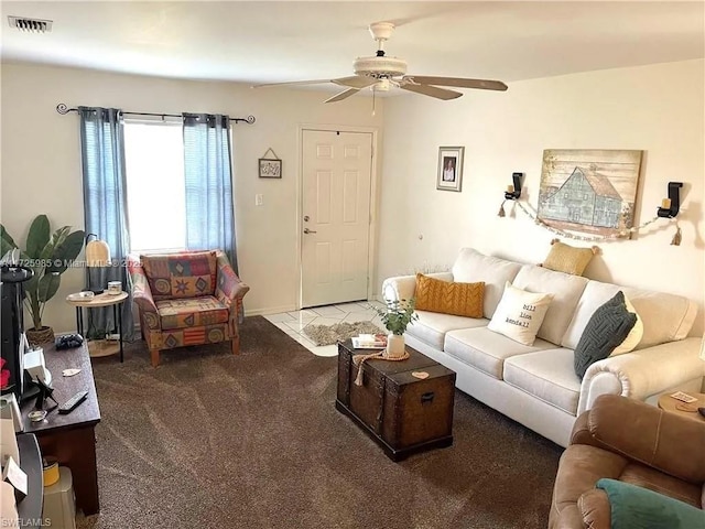 living room with ceiling fan and carpet flooring