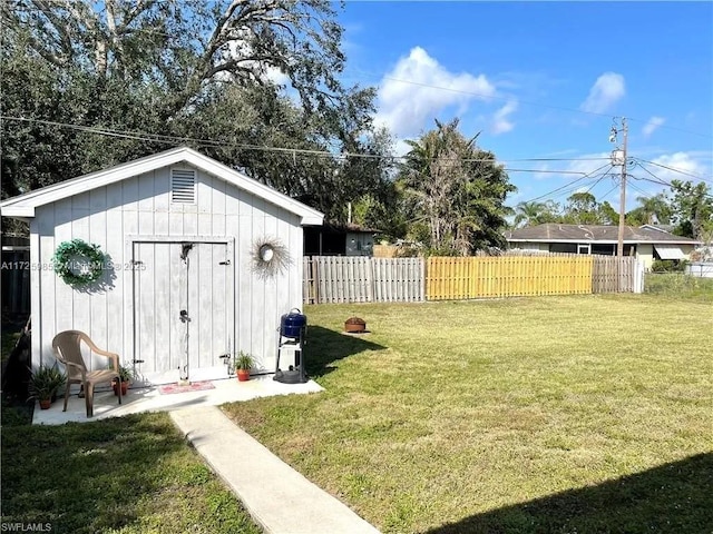 view of outbuilding with a lawn