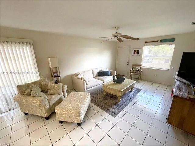 tiled living room featuring ceiling fan