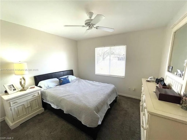 bedroom with ceiling fan and dark carpet