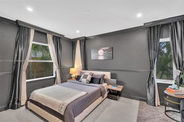 bedroom featuring crown molding and multiple windows