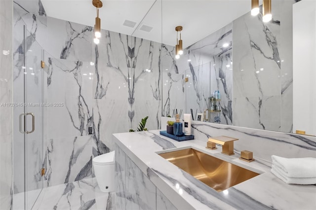 bathroom featuring walk in shower, vanity, and toilet