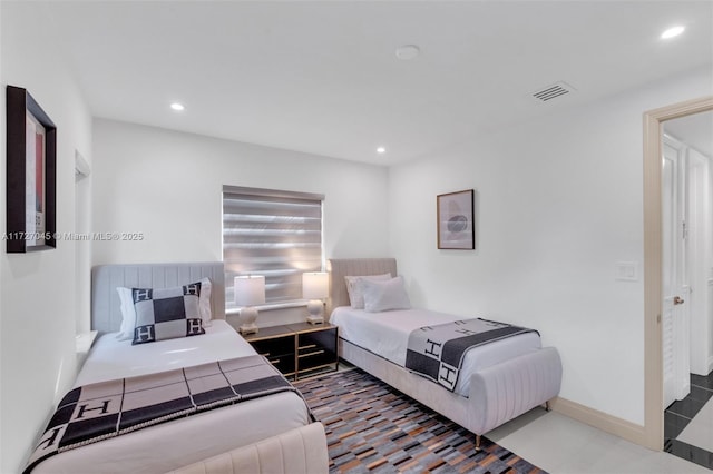 bedroom with tile patterned floors