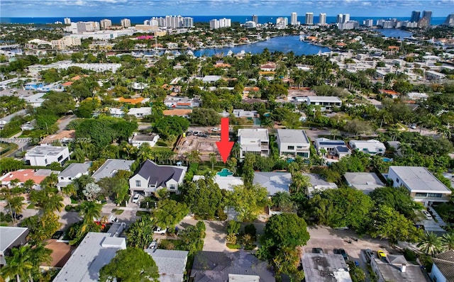 birds eye view of property featuring a water view