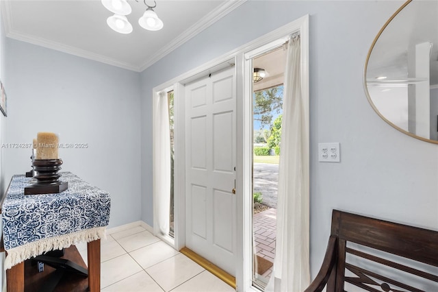 tiled foyer featuring ornamental molding