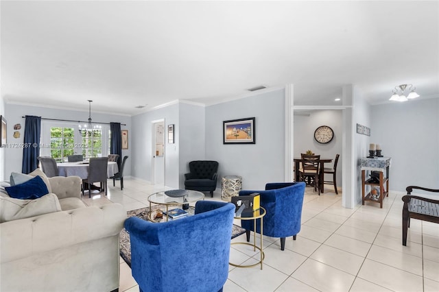 living room featuring light tile patterned floors, crown molding, and a notable chandelier