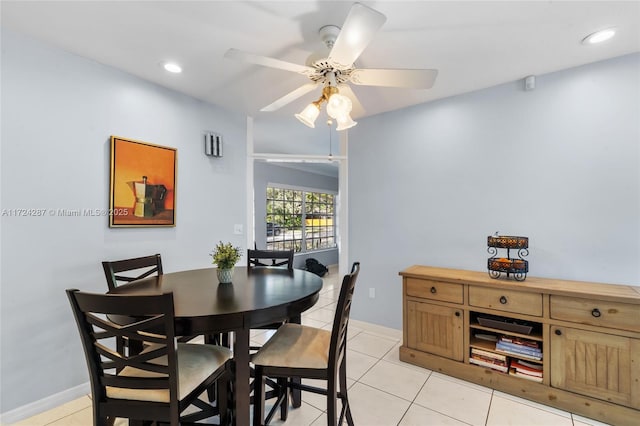 dining area featuring ceiling fan and light tile patterned flooring