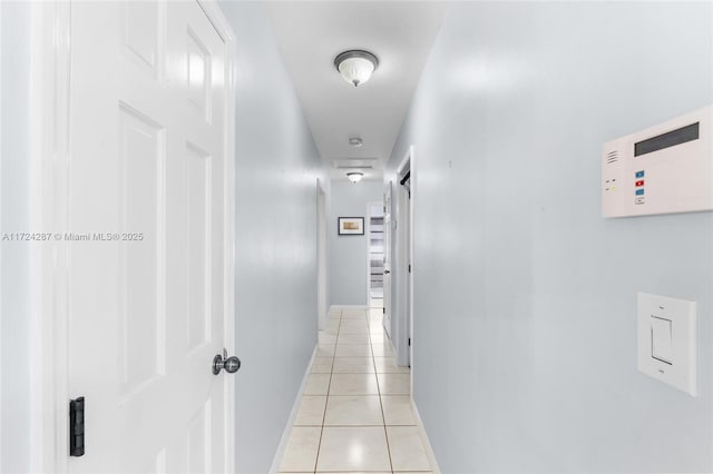 corridor featuring light tile patterned flooring