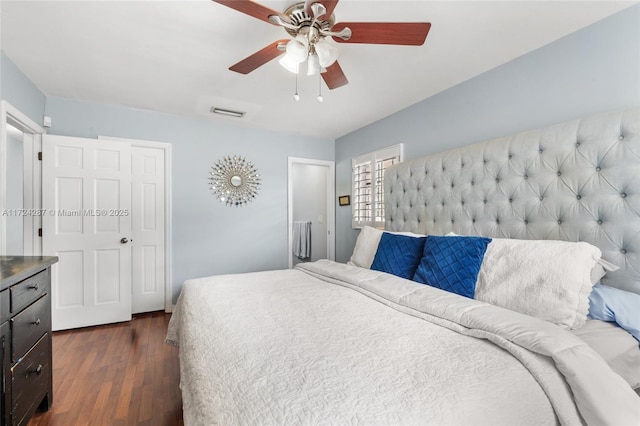 bedroom with ceiling fan and dark hardwood / wood-style flooring