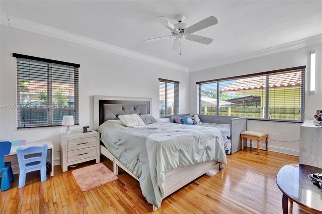 hall featuring crown molding and light hardwood / wood-style flooring