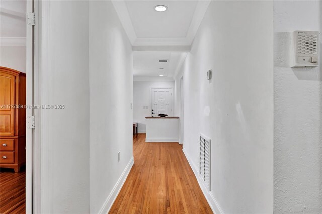 bedroom with ceiling fan, hardwood / wood-style floors, a closet, and ornamental molding