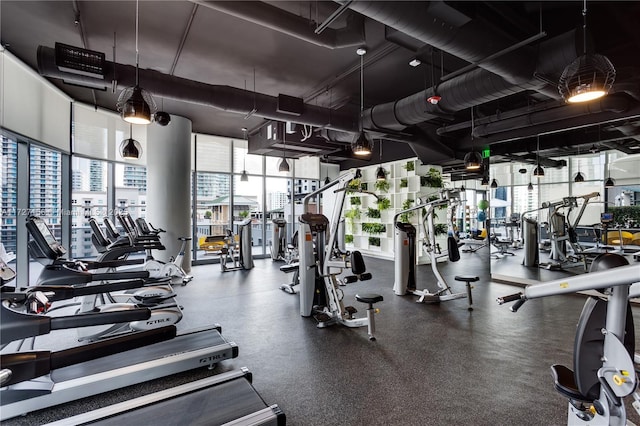 workout area featuring expansive windows