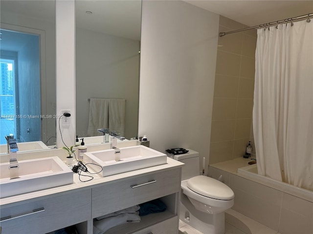 full bathroom featuring toilet, vanity, and shower / tub combo with curtain