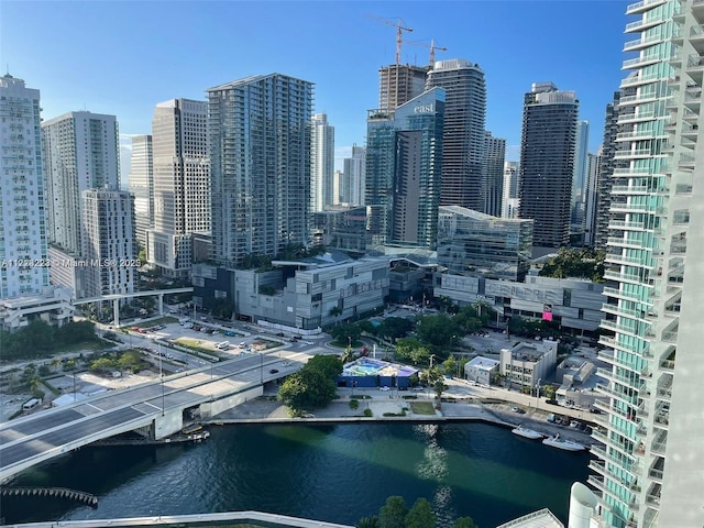 property's view of city featuring a water view