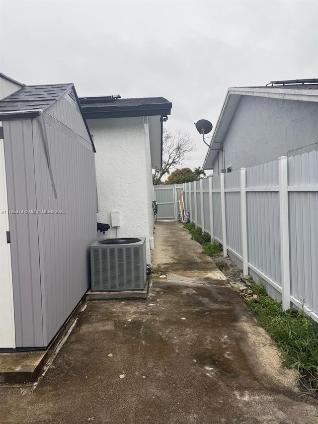 view of side of property with central AC unit