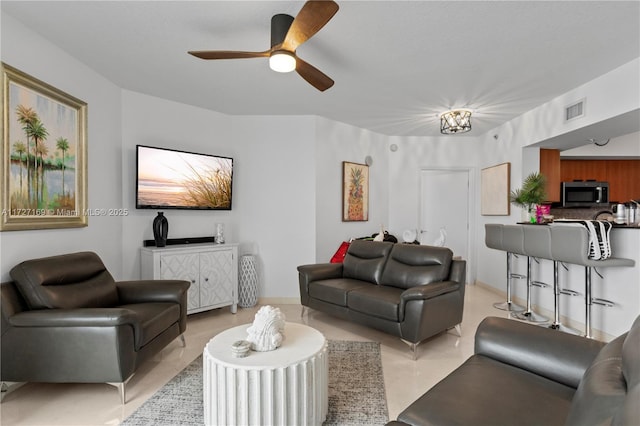 living room with ceiling fan