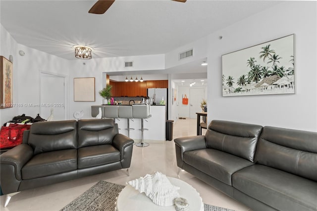 living room featuring ceiling fan