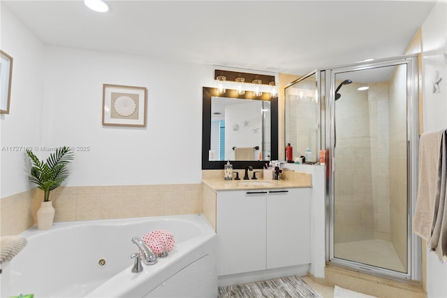 bathroom featuring vanity and shower with separate bathtub