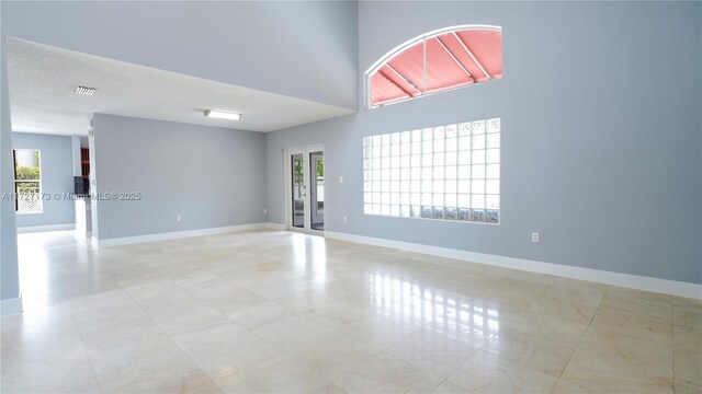 unfurnished room with a healthy amount of sunlight