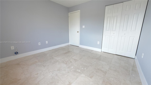 unfurnished bedroom with a closet