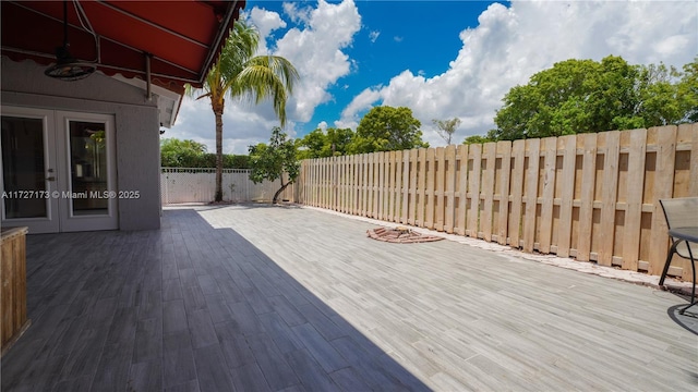 wooden deck featuring french doors