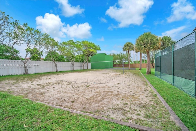 view of property's community with a yard and volleyball court