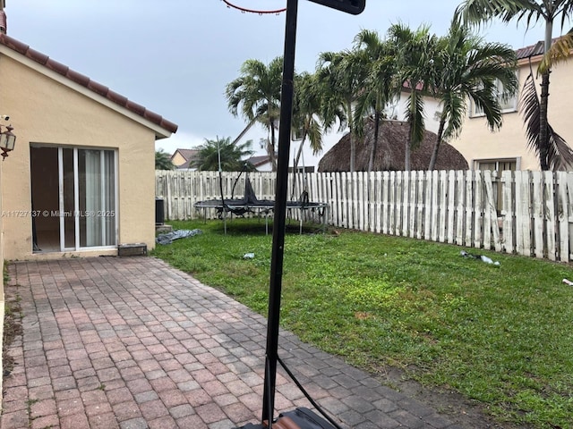 view of patio / terrace featuring central AC and a trampoline