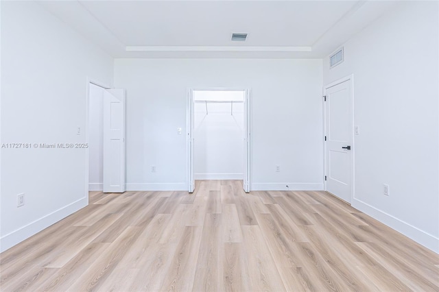 unfurnished room with light wood-type flooring