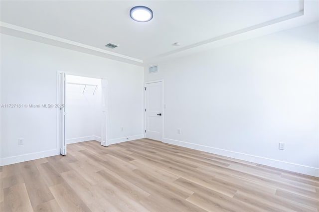 spare room with light wood-type flooring