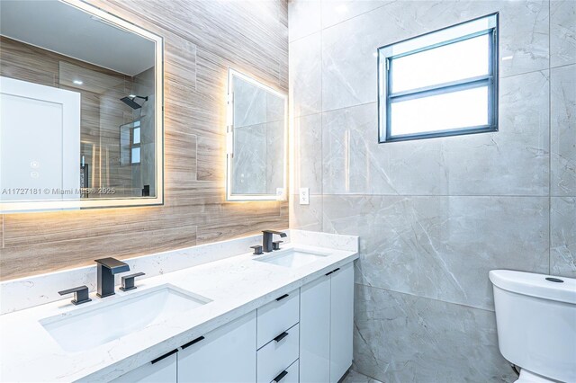 bathroom with toilet and vanity