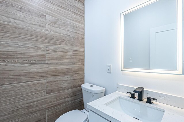 bathroom with toilet and vanity